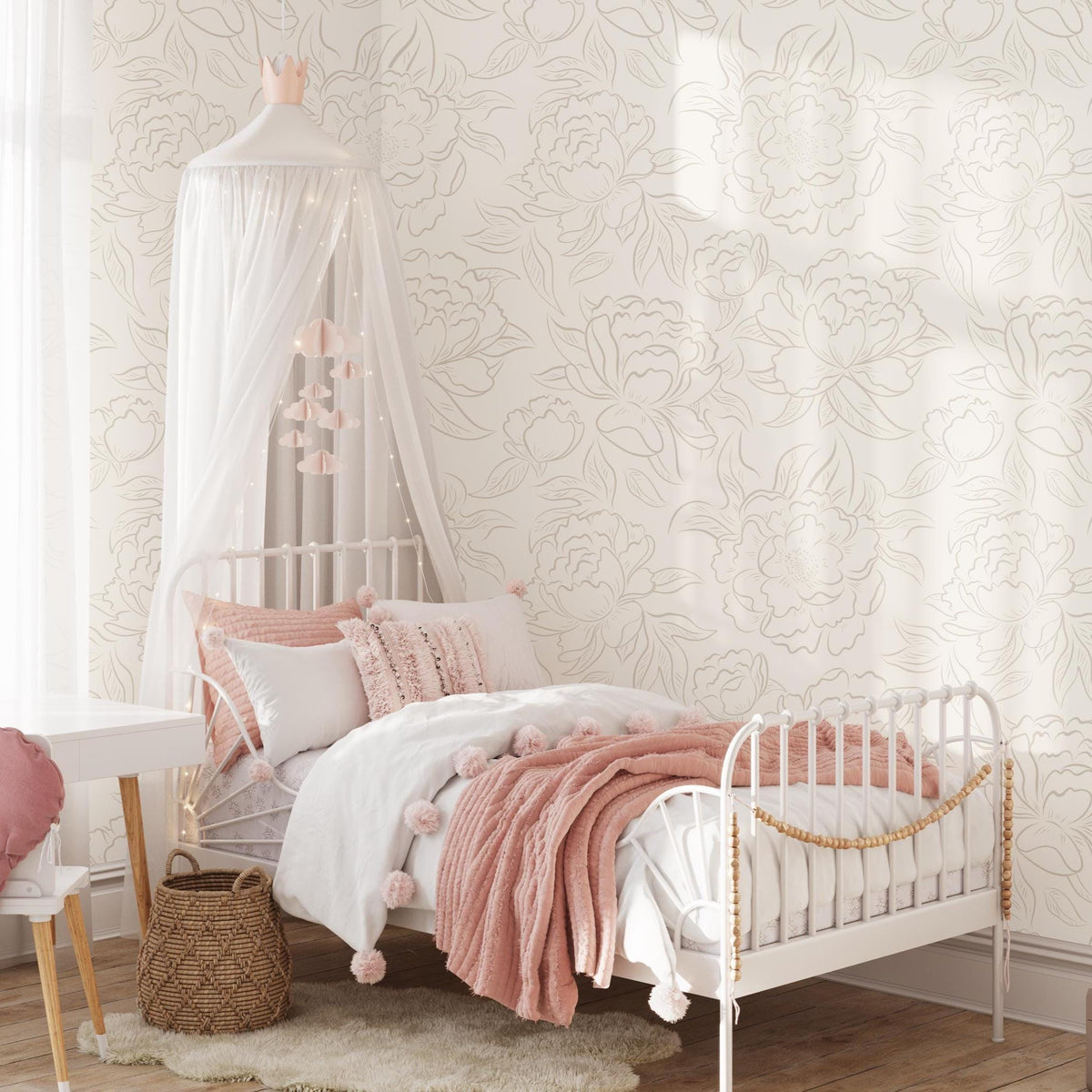 Girls' bedroom with a canopy and pink bedding against neutral beige Peony Sketch wallpaper