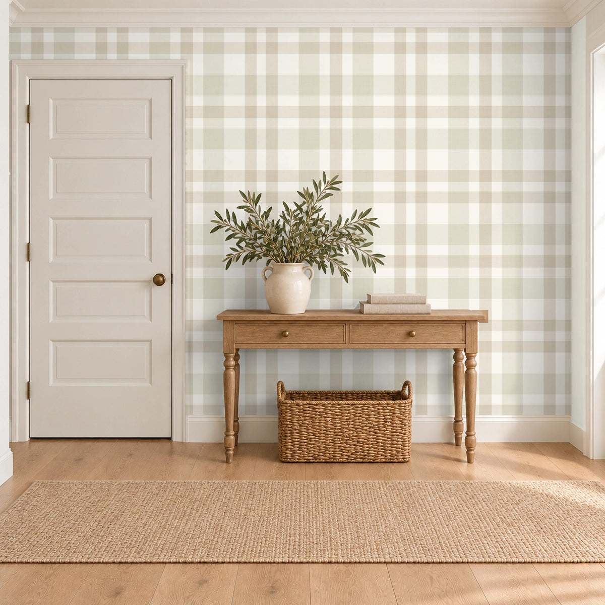 Entryway with a console table and potted plant against beige and cream Hollis plaid wallpaper