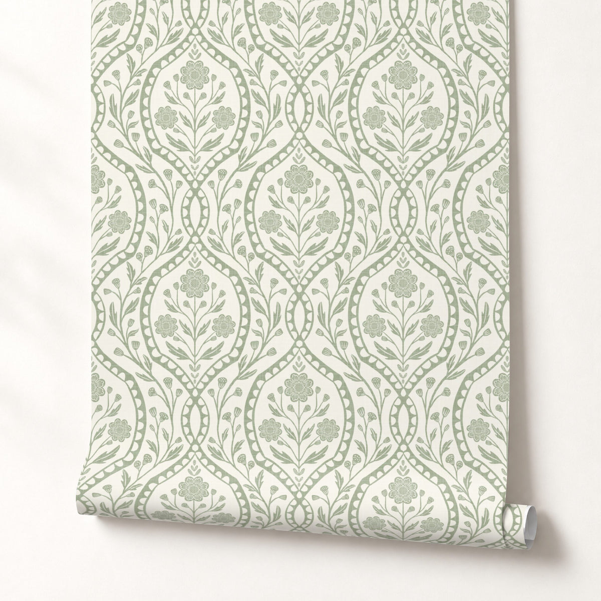 a repeating pattern of green floral designs on a white background.
