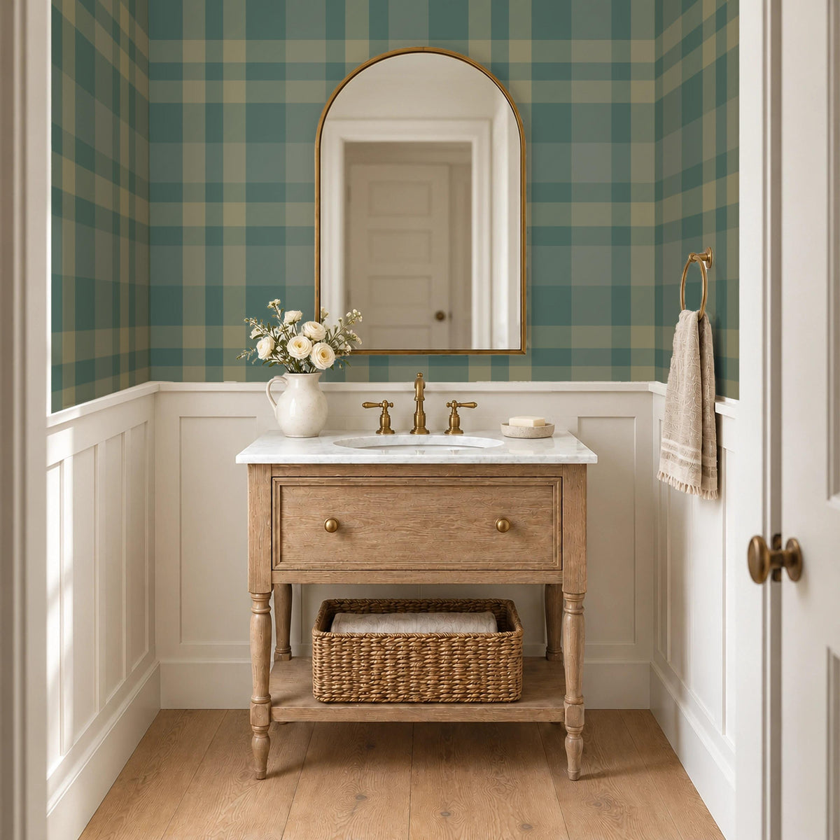 Dark green plaid wallpaper above wainscoting in a powder room