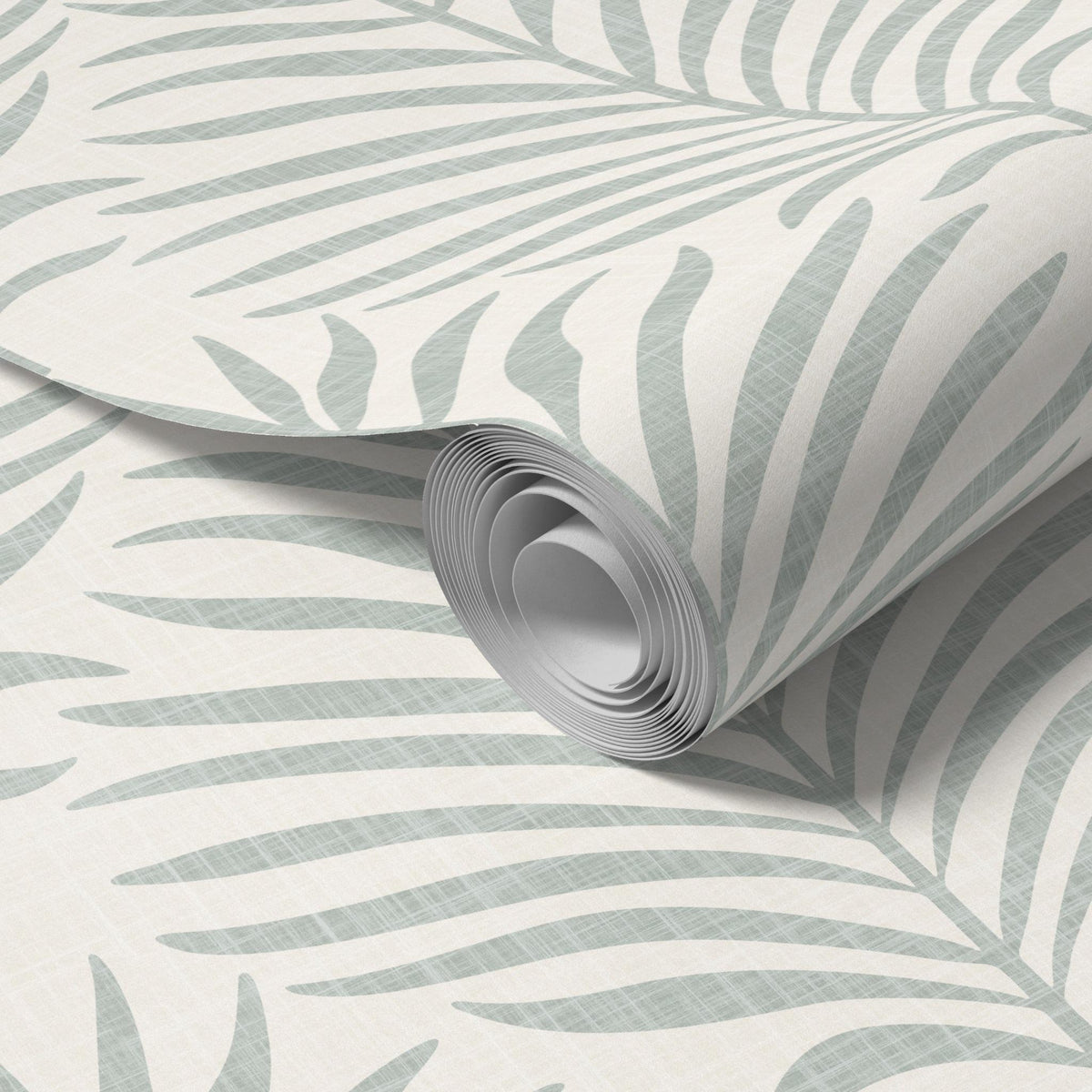 Close-up of a rolled panel of gray green and white Palm Breeze palm leaf wallpaper