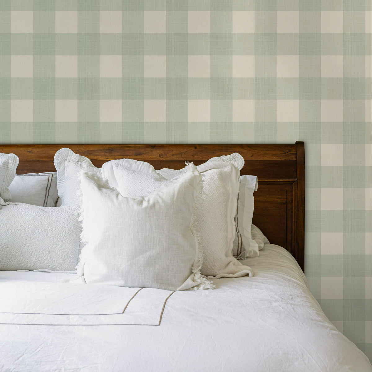 Sage green gingham prepasted wallpaper in a cottage master bedroom
