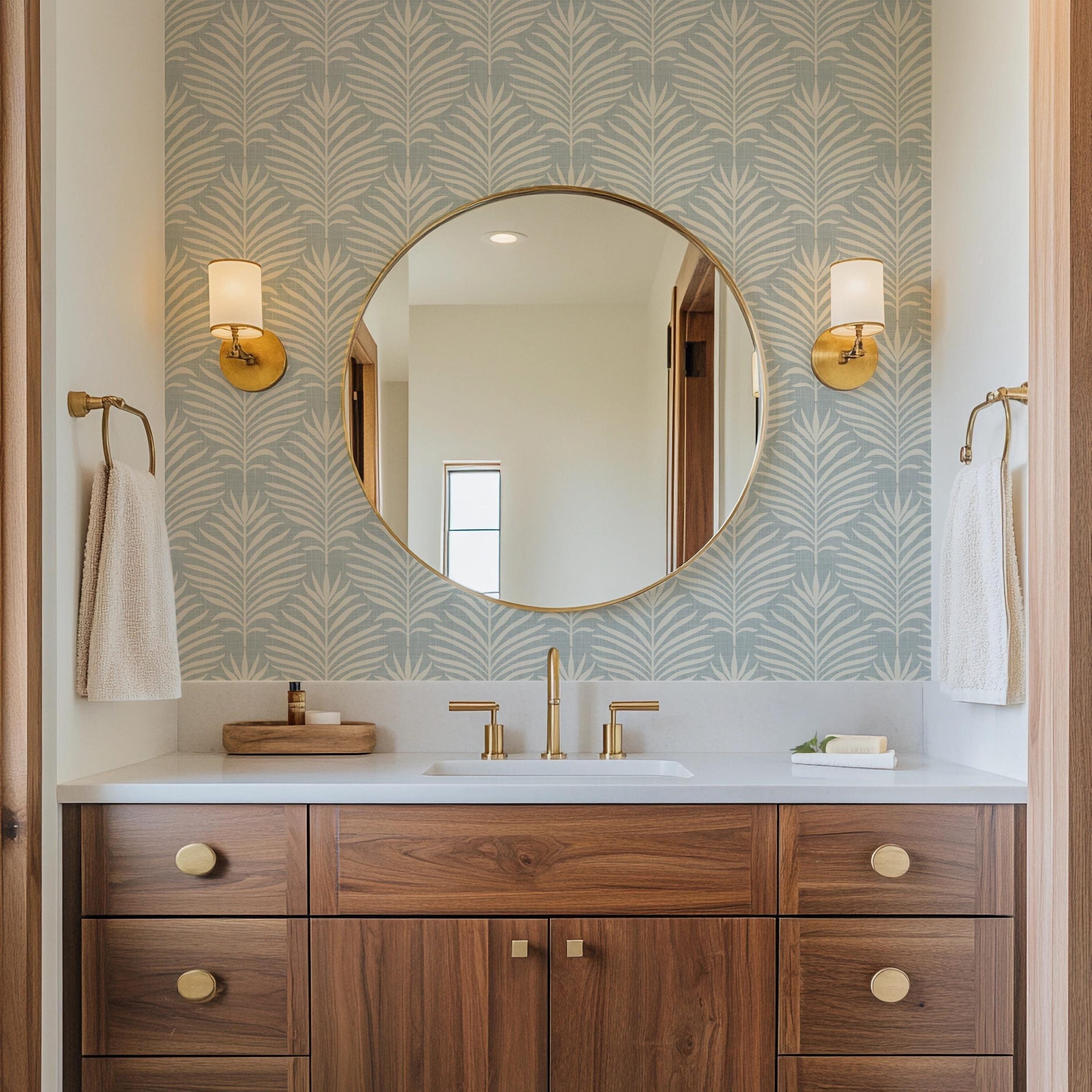 light blue palm leaf removable peel and stick or prepasted wallpaper with linen texture for a tropical boho inspired space
