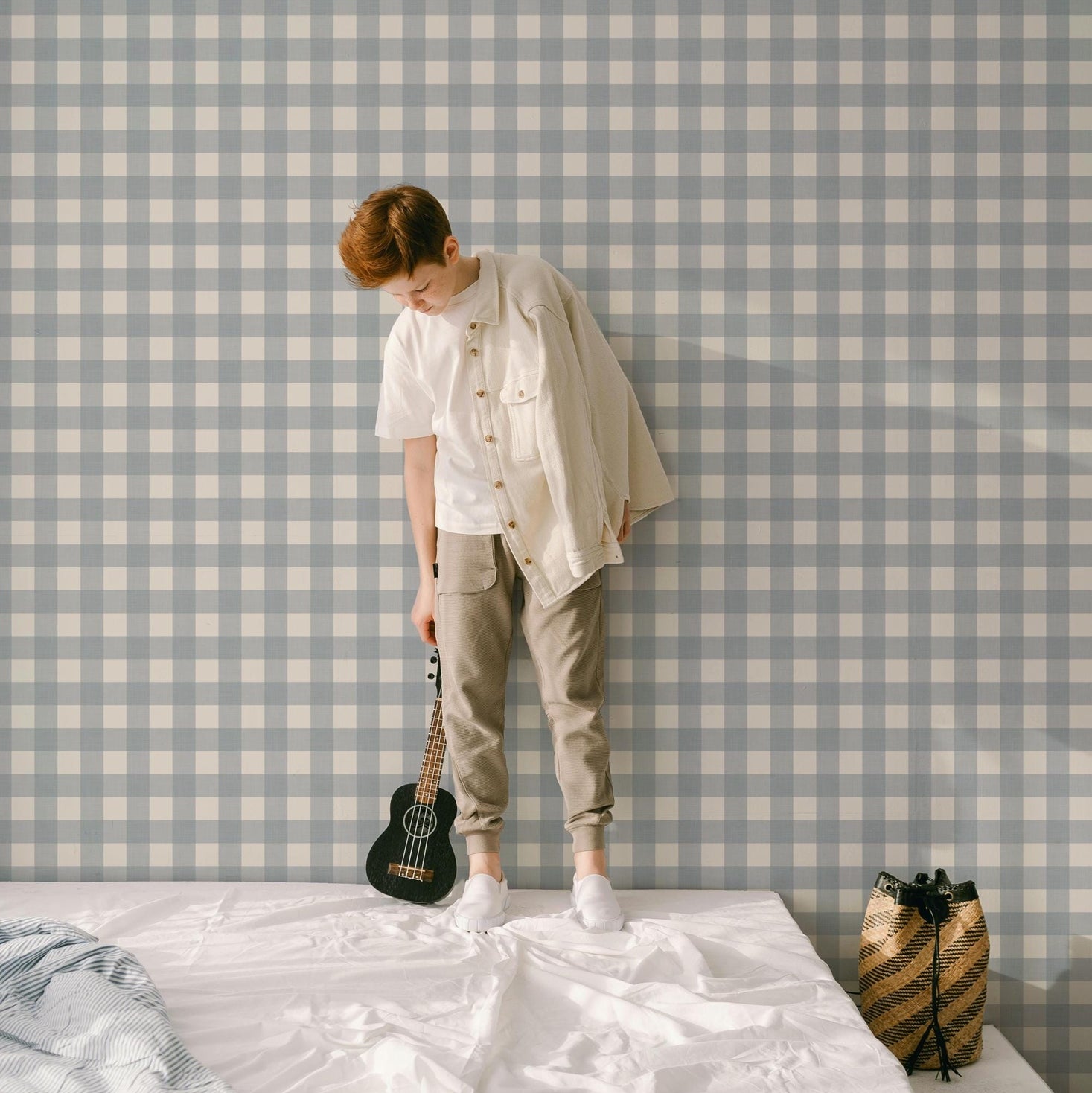 kids statement wall with light blue and off-white gingham wallpaper with a soft linen texture. Buffalo check style, ideal for baby boy nurseries, coastal or cottagecore spaces. Removable, eco-friendly, made in the USA, and designed by an independent artist.