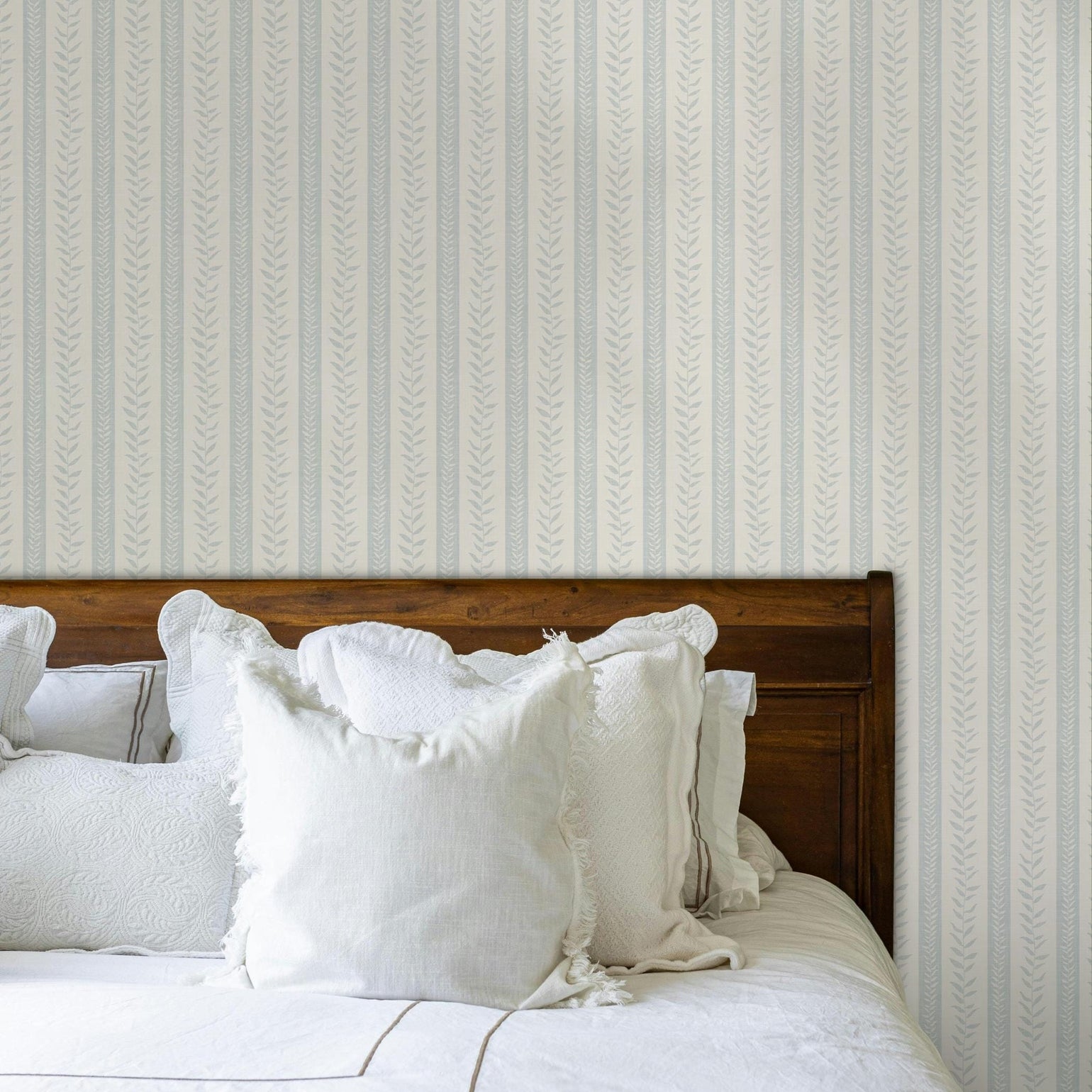 modern coastal wallpaper with tropical botanical stripe in light blue and white for baby boy nursery, bedroom, bathroom accent wall, or calming beach home inspired spaces. Shown in peel and stick or prepasted removable renter friendly wallpaper.