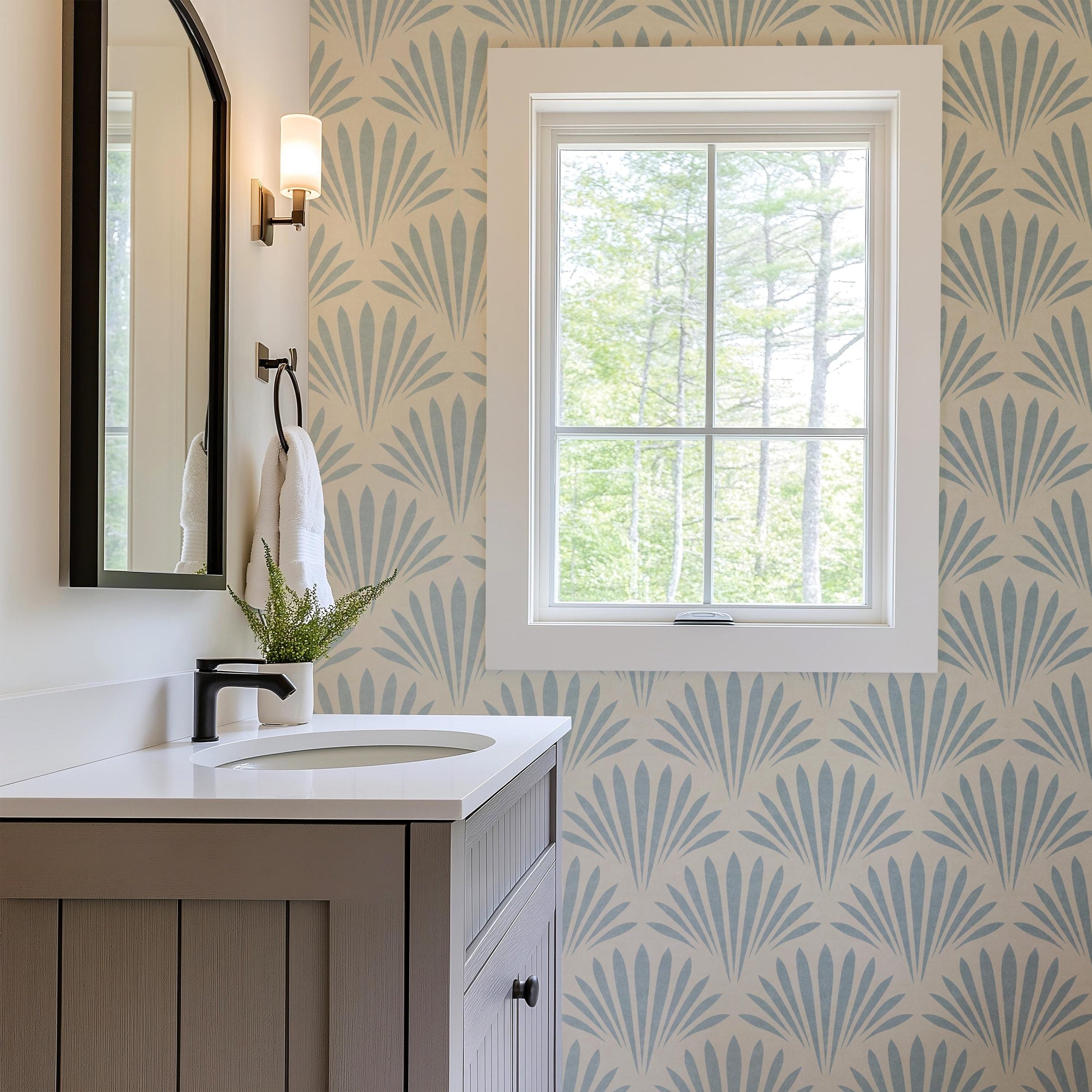 light blue mediterranean scallop wallpaper resembling floral or seashell. Art Deco inspired and fitting into a modern coastal interior. Shown in removable renter friendly peel and stick or prepasted, perfect for coastal bathrooms, bedrooms, or accent walls in mid century modern interiors