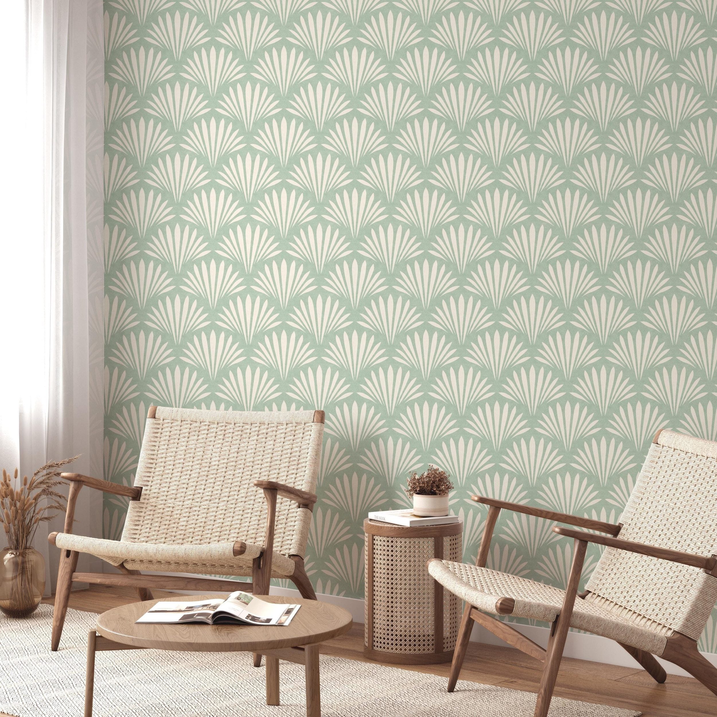 Wallpaper shown in peel and stick or removable pre-pasted in aqua green and off white with seashell palm fan print. A tropical boho modern coastal print for bathroom wallpaper, powder room, baby nursery, bedroom or accent wall.