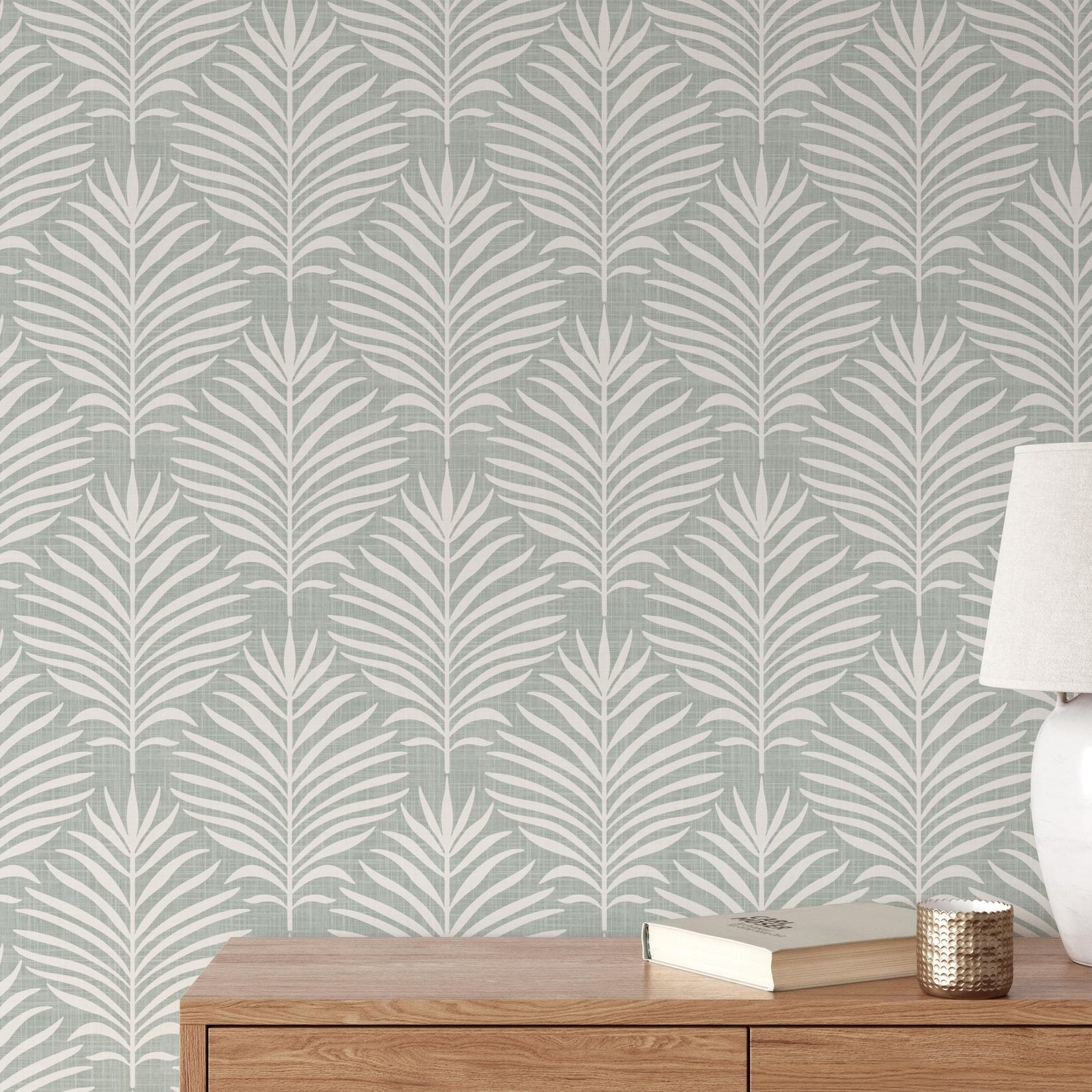 Boho Tropical Peel and Stick Wallpaper shown in peel and stick or pre-pasted. Neutral Blue Green Botanical Palm Leaf perfect for Modern Coastal interiors, baby nursery, bathroom or powder room.