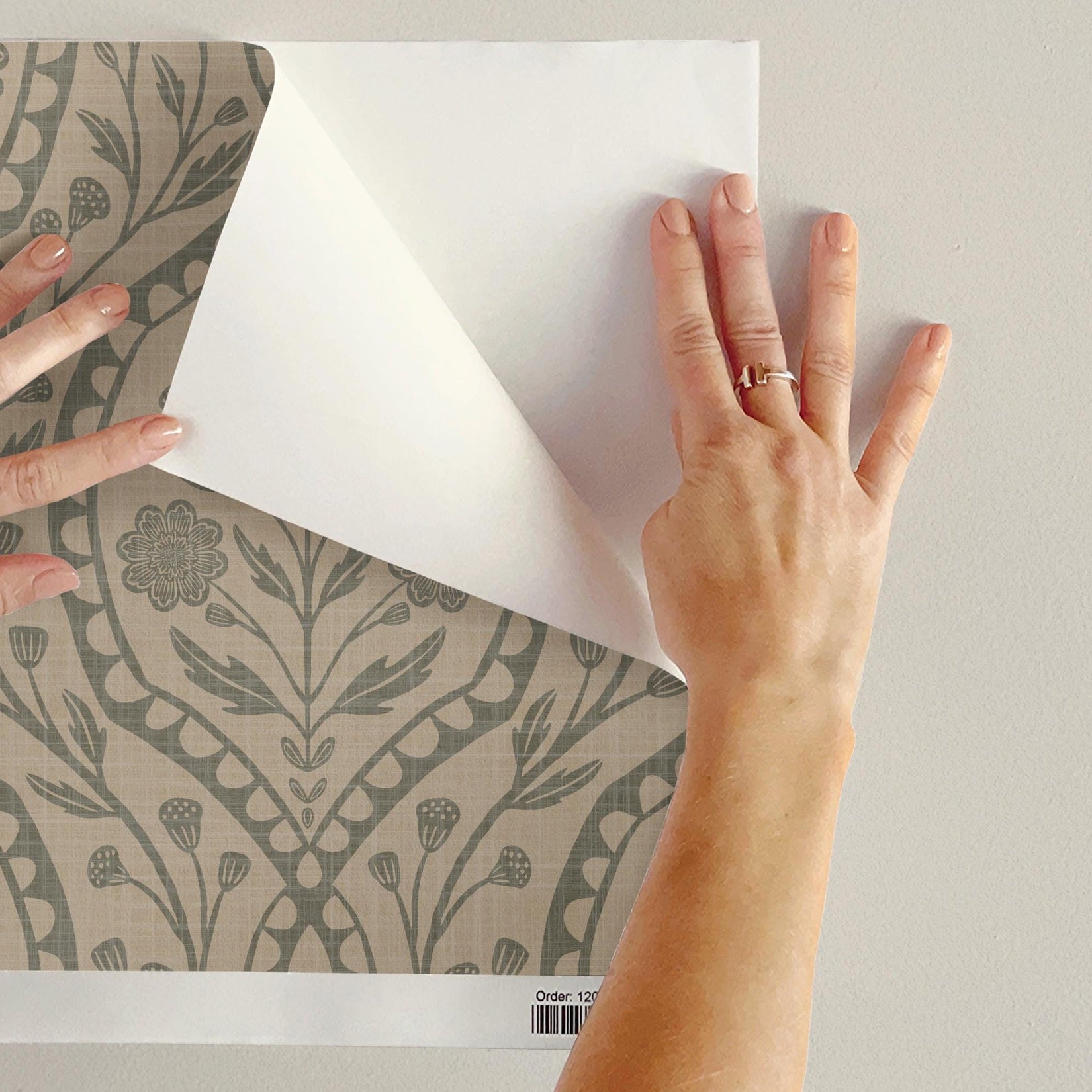 wallpaper shown in peel and stick or removable prepasted. neutral sage green and beige French country wallpaper with elegant wildflower damask. Renter-friendly subtle botanical design for a timeless baby girl nursery, bedroom, or bathroom wall.