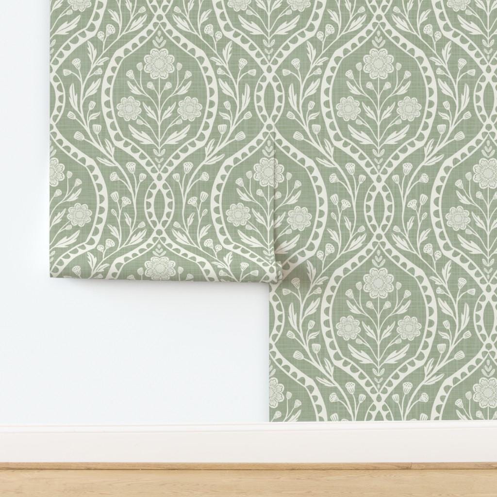 Sage green and white floral wallpaper with a wildflower floral damask pattern. Shown in peel and stick or prepasted for a removable renter friendly option for traditional or french country aesthetic suitable for baby nursery, bedroom, bathroom, kitchen or dining room.