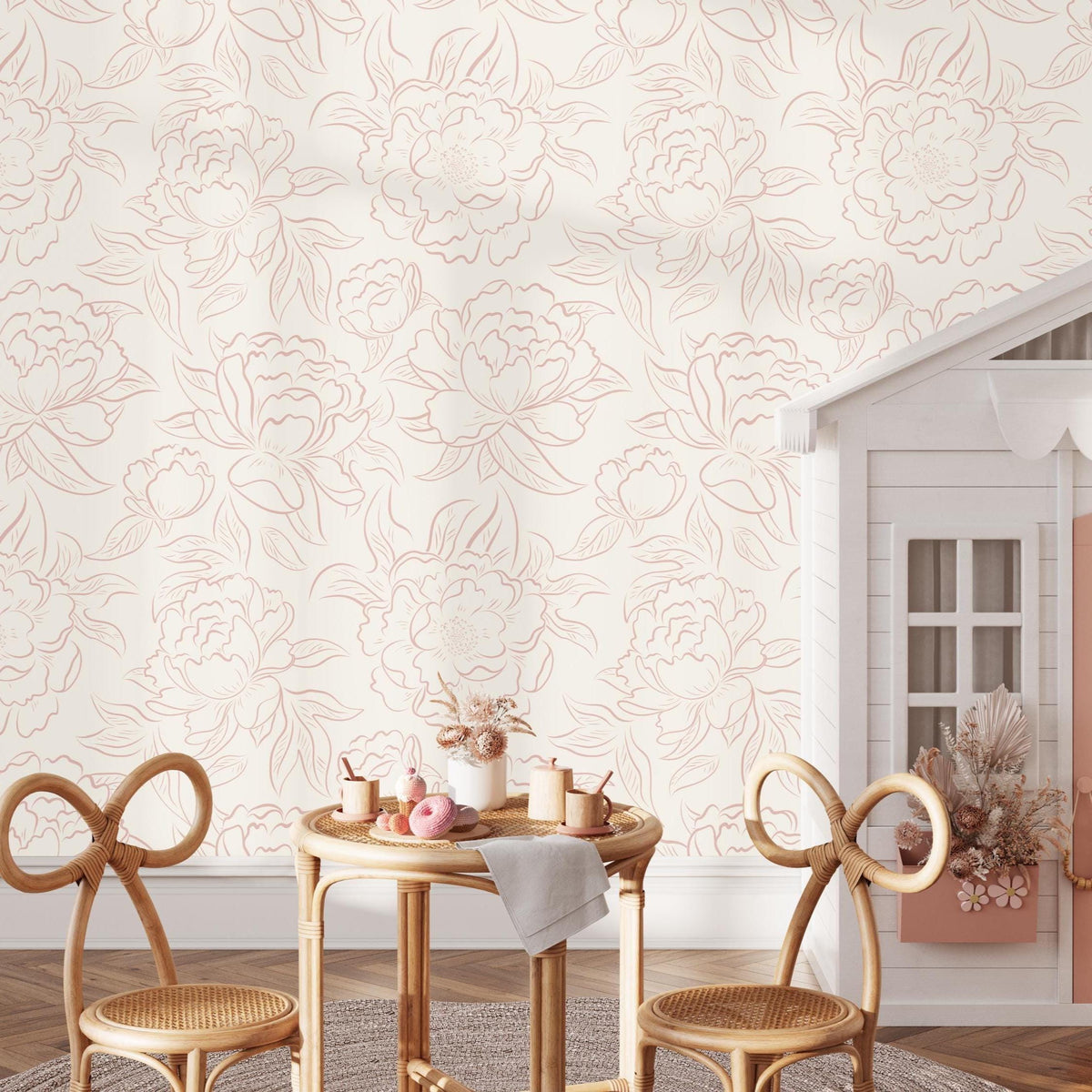 Playroom with a kids' table and bow chairs against pink Peony Sketch floral wallpaper