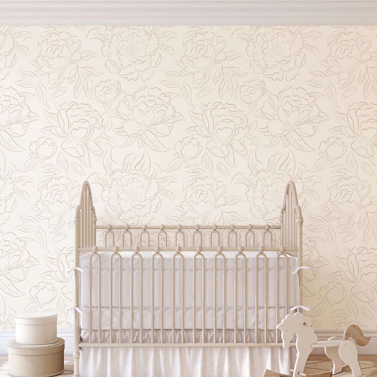 Nursery with a white crib against neutral beige Peony Sketch floral wallpaper