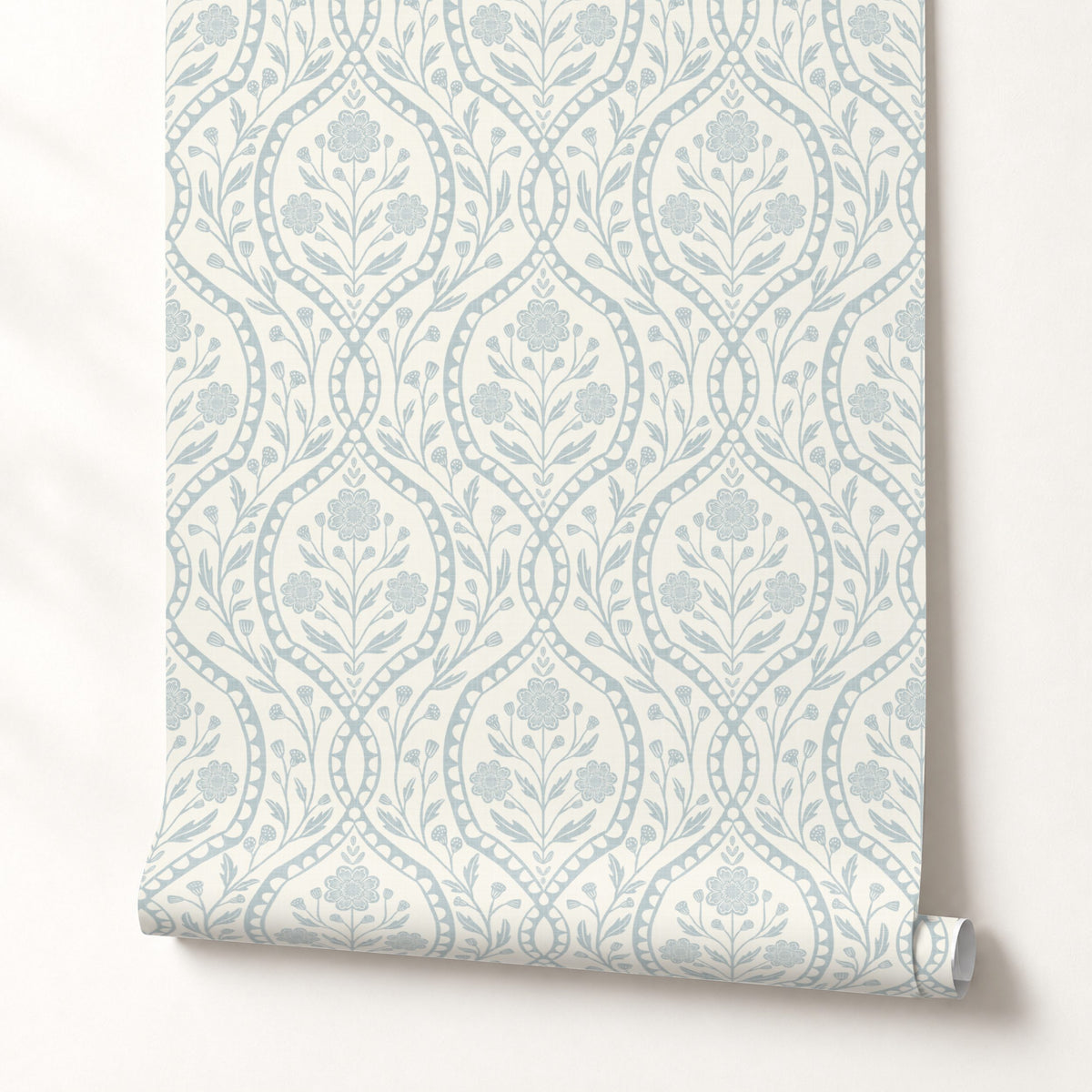 Light blue French country wallpaper with elegant wildflowers on an off-white background. Renter-friendly design for nursery, bedroom, or bathroom wall.