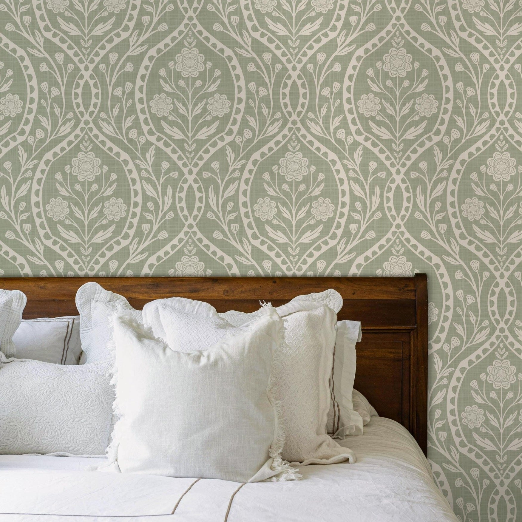 Sage green and white floral wallpaper with a wildflower floral damask pattern. Shown in peel and stick or prepasted for a removable renter friendly option for traditional or french country aesthetic suitable for baby nursery, bedroom, bathroom, kitchen or dining room.