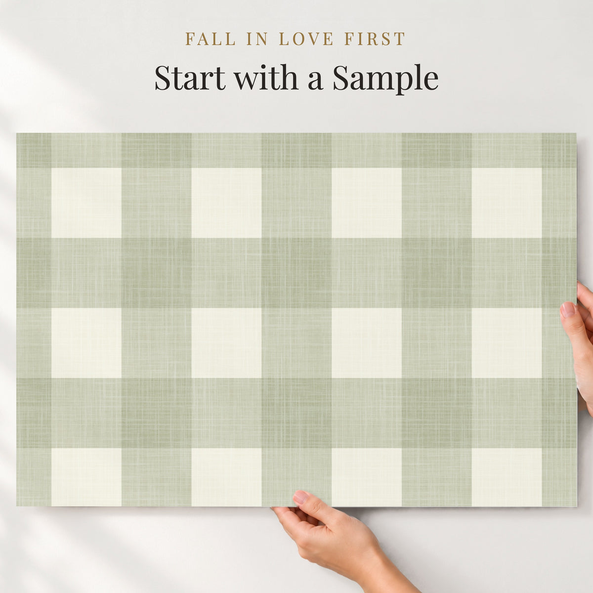 A hand is holding a piece of paper with a checkered pattern on it, with text above the image that reads "Fall in love first. Start with a sample".