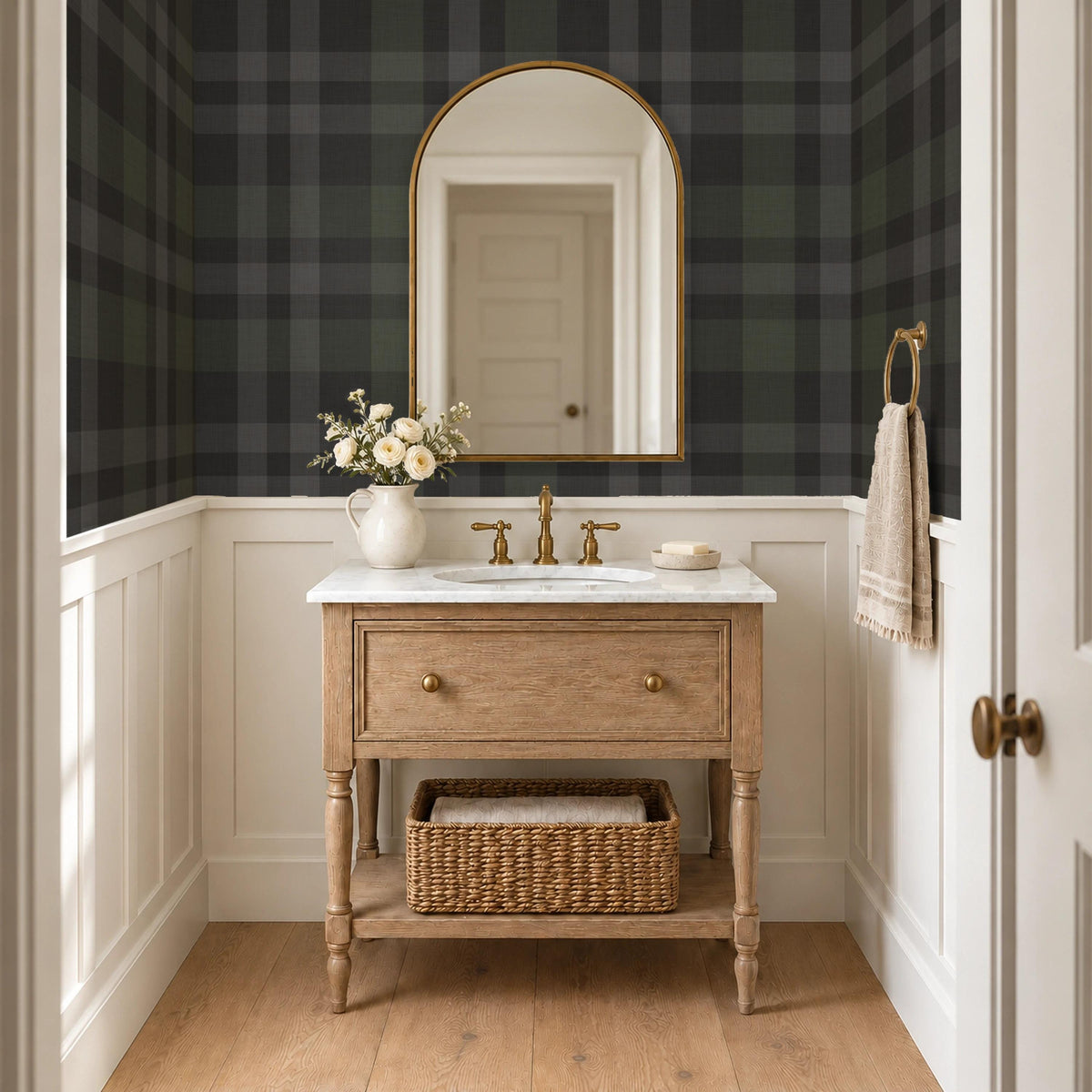 Black plaid wallpaper above wainscoting in a dark powder room