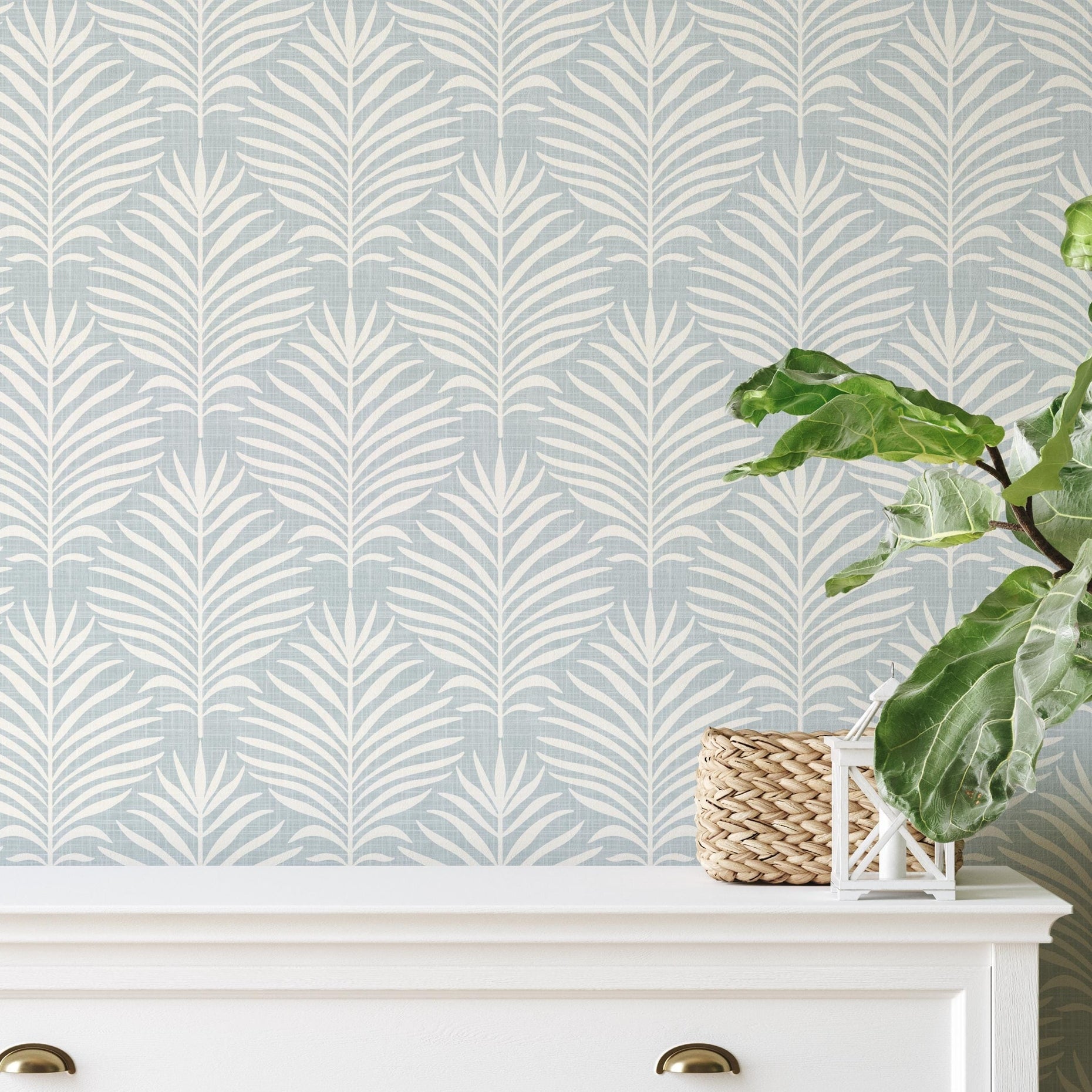 blue and off white palm leaf removable wallpaper available in peel and stick with a faux linen texture for japandi, coastal, and boho decor styles