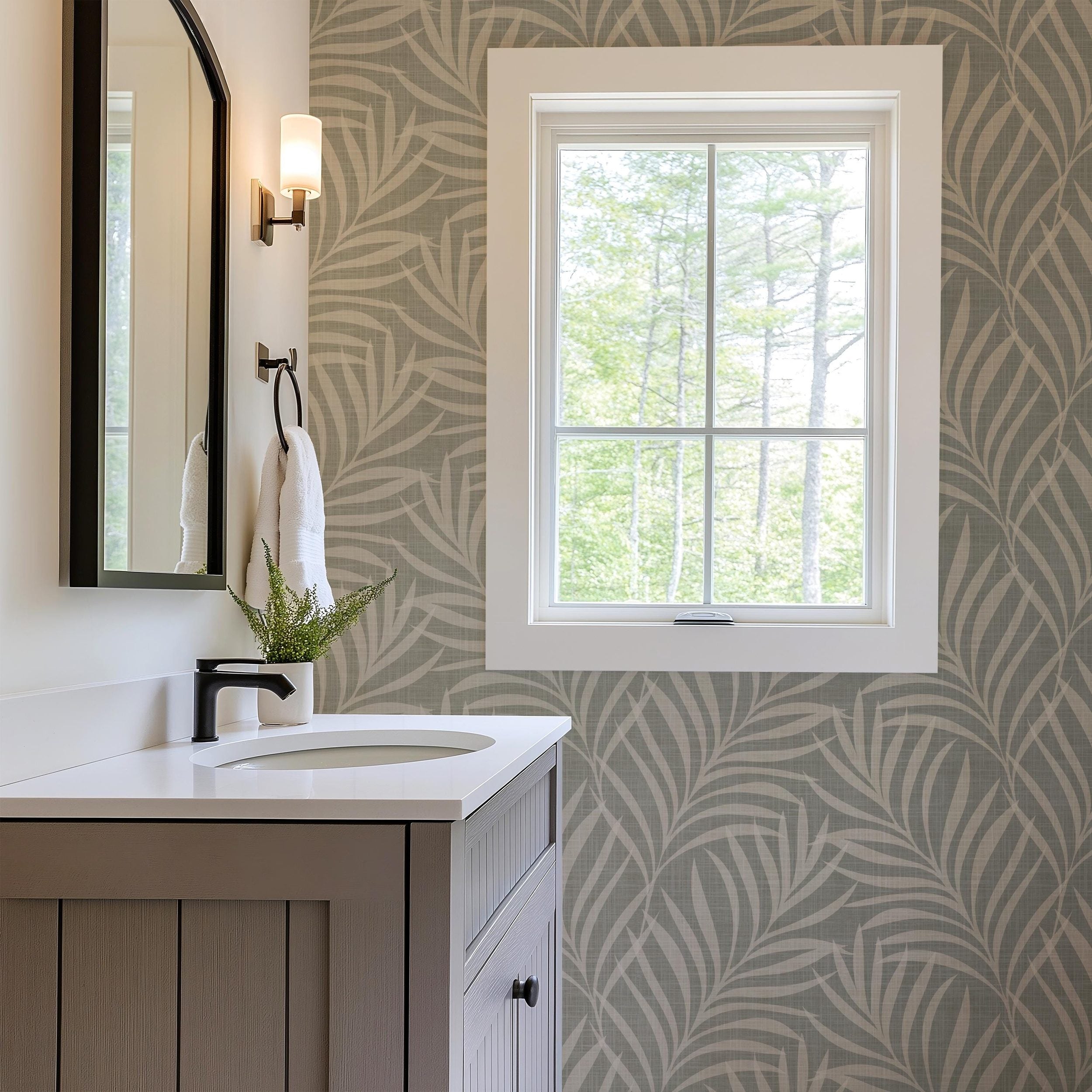 Neutral olive green wallpaper available in peel and stick and prepasted in a modern tropical boho style with palm leaves and subtle linen texture, ideal for coastal bedrooms, powder rooms, or Japandi accent walls. featured as bathroom accent wall. featured as bathroom accent wall