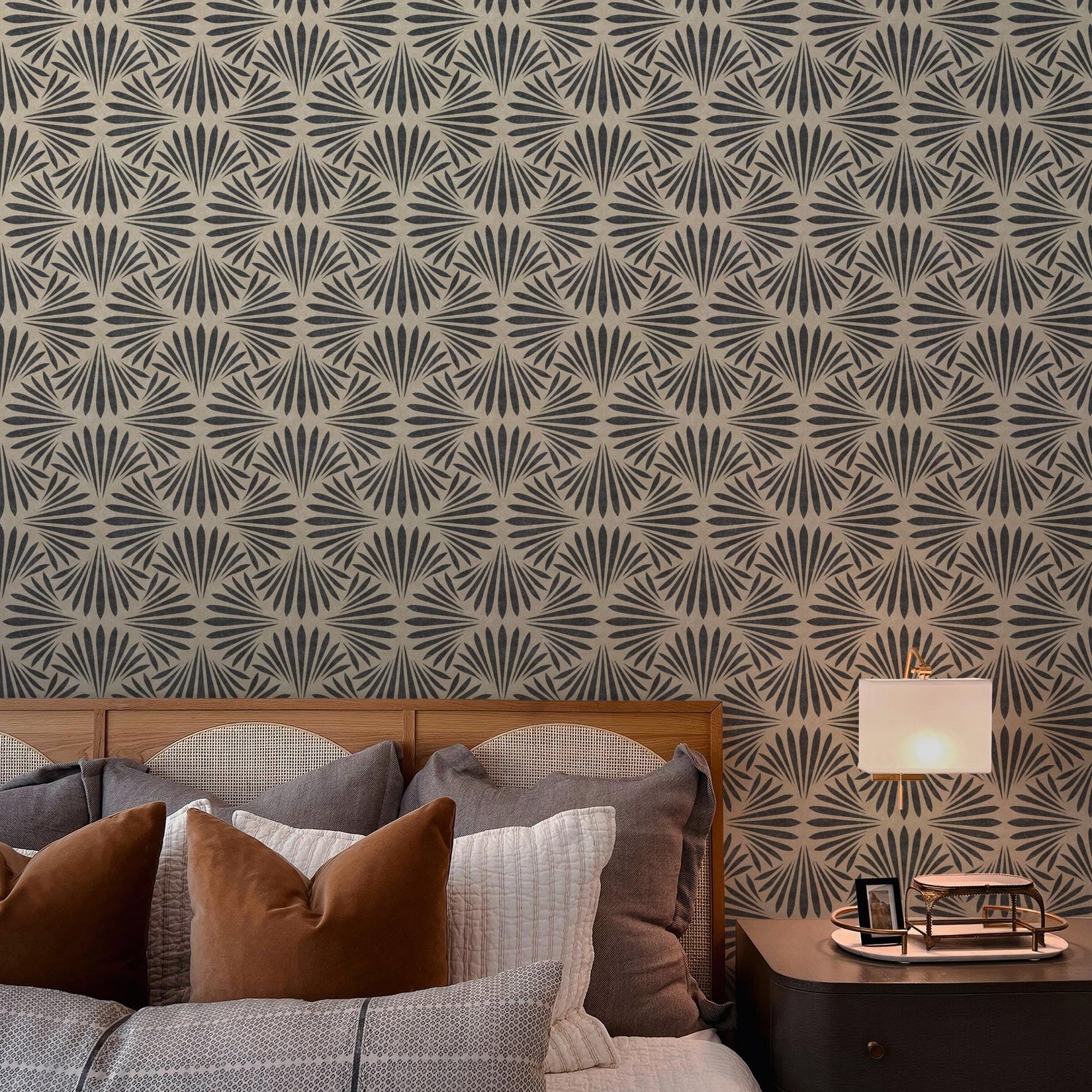 Neutral black and tan art deco moody floral dark botanical wallpaper available in peel and stick and prepasted in a modern tropical boho style with a subtle linen texture, ideal for coastal bedrooms, powder rooms, or Japandi accent walls. featured as bathroom accent wall.