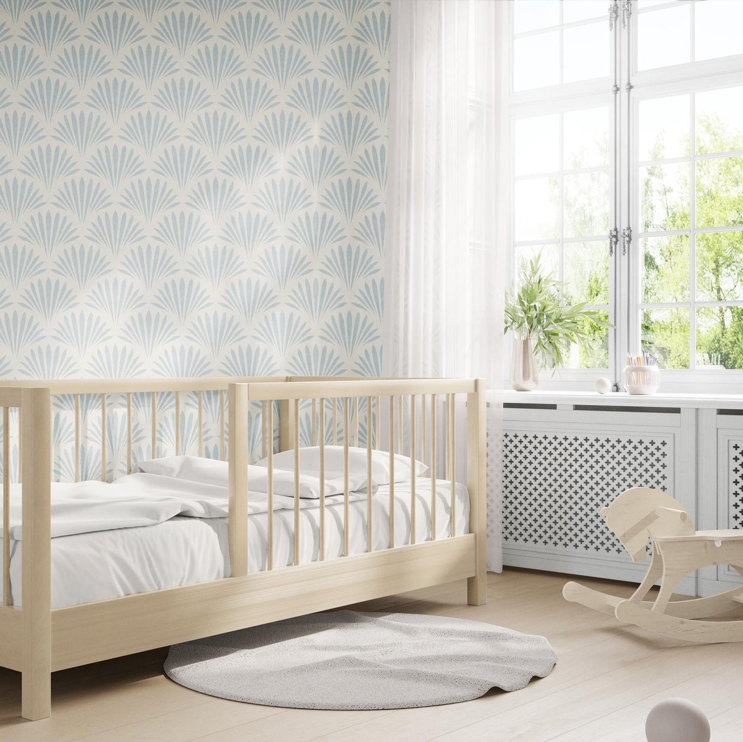 light blue mediterranean scallop wallpaper resembling floral or seashell. Art Deco inspired and fitting into a modern coastal interior. Shown in removable renter friendly peel and stick or prepasted, perfect for coastal bathrooms, bedrooms, or accent walls in mid century modern interiors