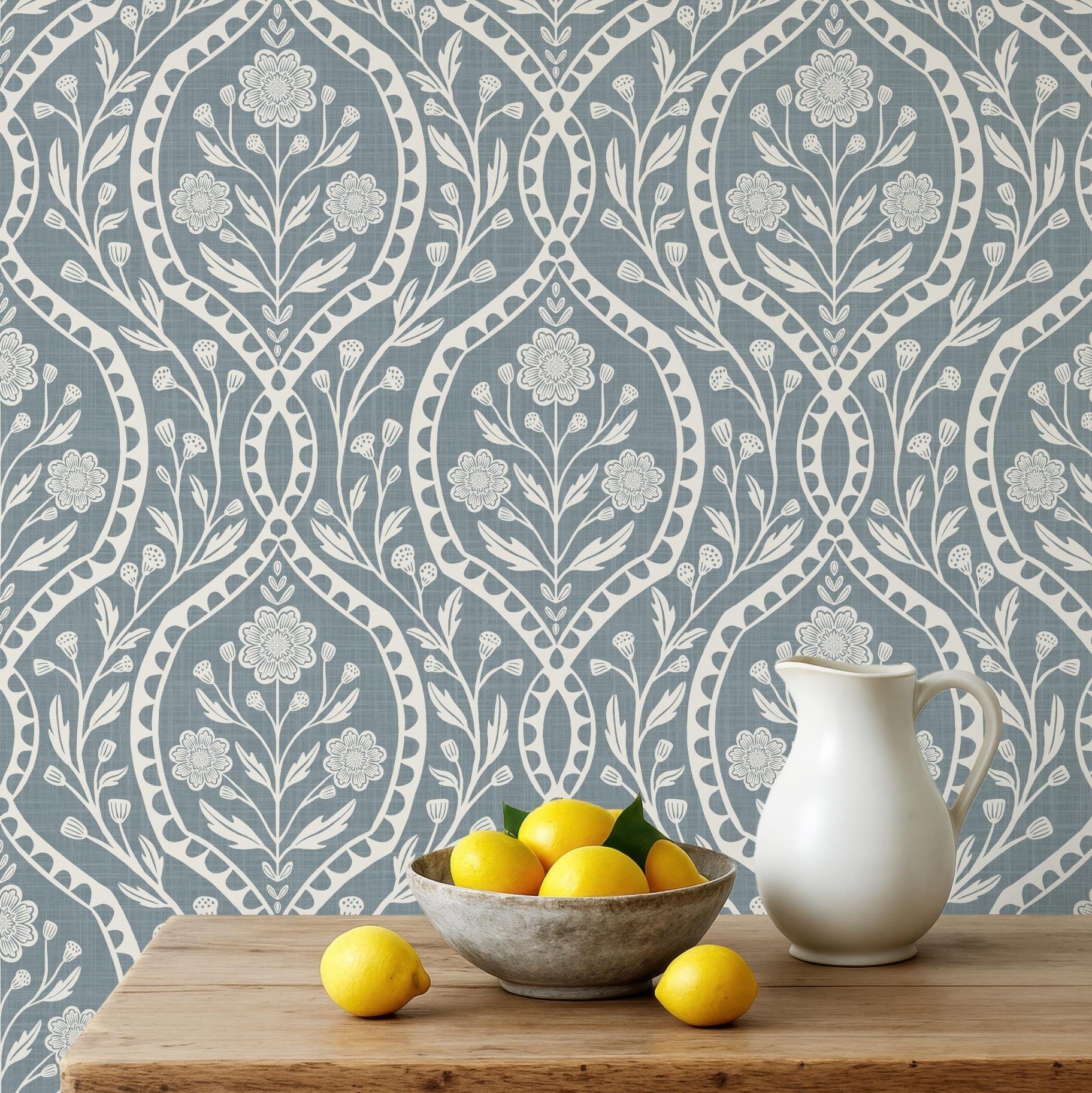 blue and white floral wallpaper with a wildflower floral damask pattern. Shown in peel and stick or prepasted for a removable renter friendly option for traditional or french country aesthetic suitable for baby nursery, bedroom, bathroom, kitchen or dining room.