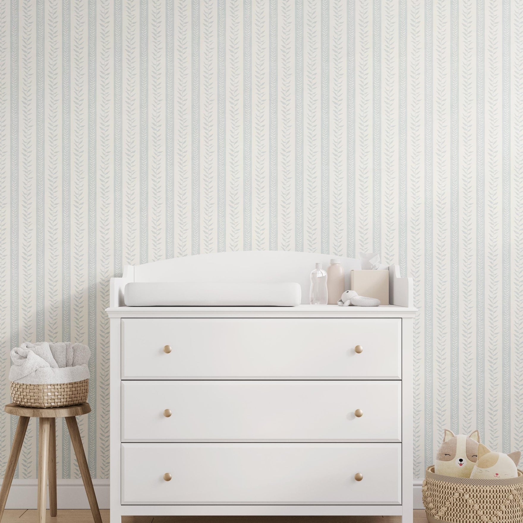 modern coastal wallpaper with tropical botanical stripe in light blue and white for baby boy nursery, bedroom, bathroom accent wall, or calming beach home inspired spaces. Shown in peel and stick or prepasted removable renter friendly wallpaper.