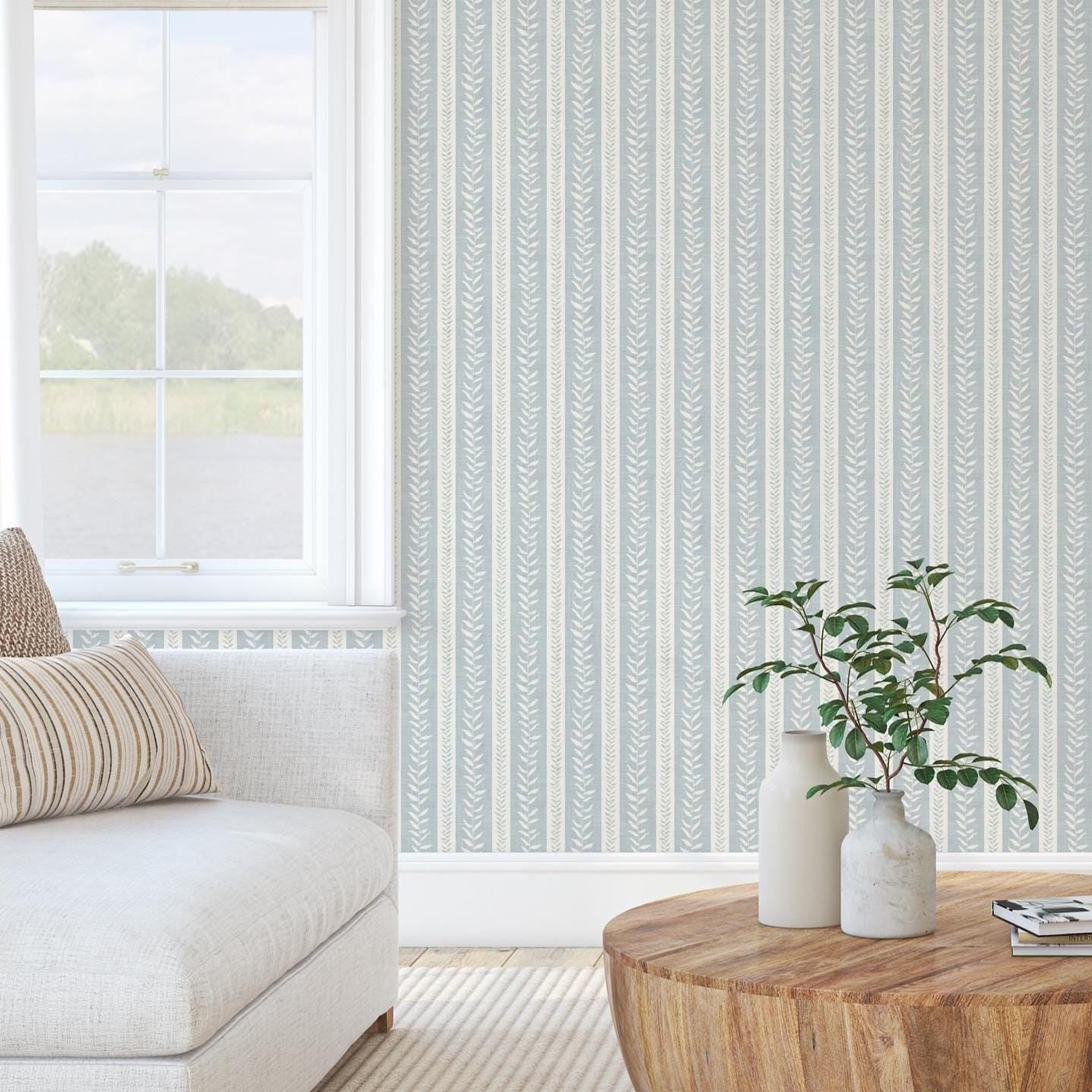 wallpaper peel and stick or prepasted in light blue and white botanical stripe for modern coastal farmhouse and french country interiors. Perfect for bathroom, powder room, or baby nursery accent walls. Light faux linen texture with tropical vine stripe for a timeless look.