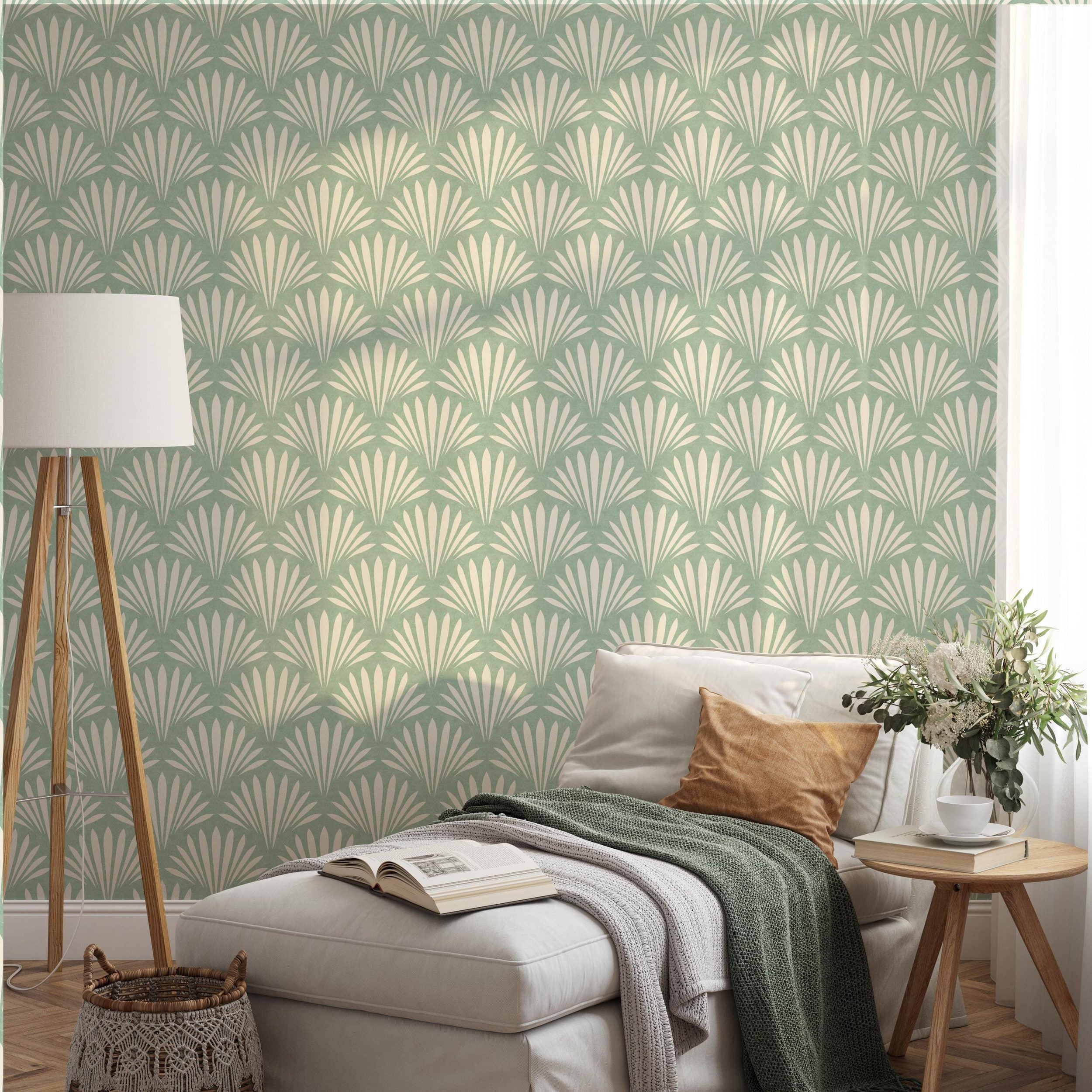 Wallpaper shown in peel and stick or removable pre-pasted in aqua green and off white with seashell palm fan print. A tropical boho modern coastal print for bathroom wallpaper, powder room, baby nursery, bedroom or accent wall.