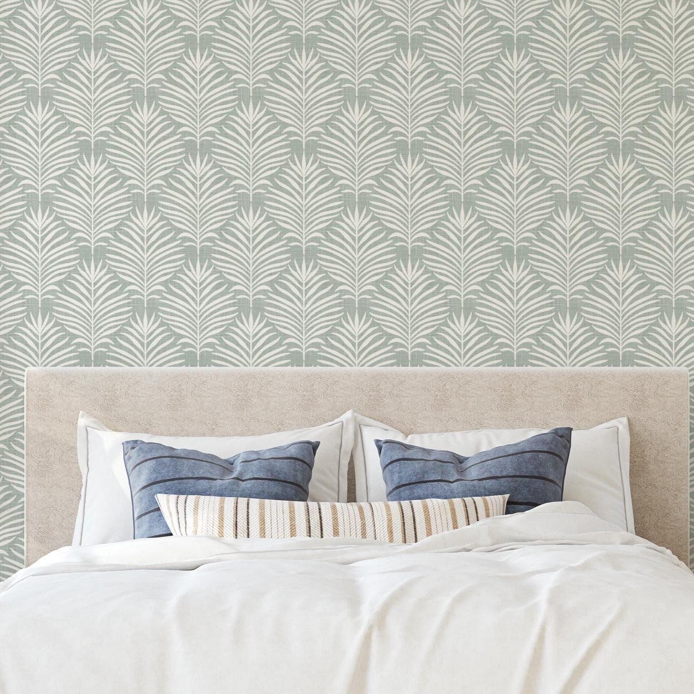 Boho Tropical Peel and Stick Wallpaper shown in peel and stick or pre-pasted. Neutral Blue Green Botanical Palm Leaf perfect for Modern Coastal interiors, baby nursery, bathroom or powder room.