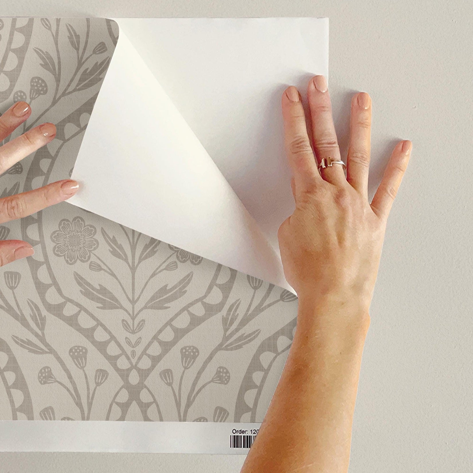 wallpaper shown in peel and stick or removable prepasted. neutral beige and off white French country wallpaper with elegant wildflower damask. Renter-friendly subtle botanical design for a timeless baby girl nursery, bedroom, or bathroom wall.