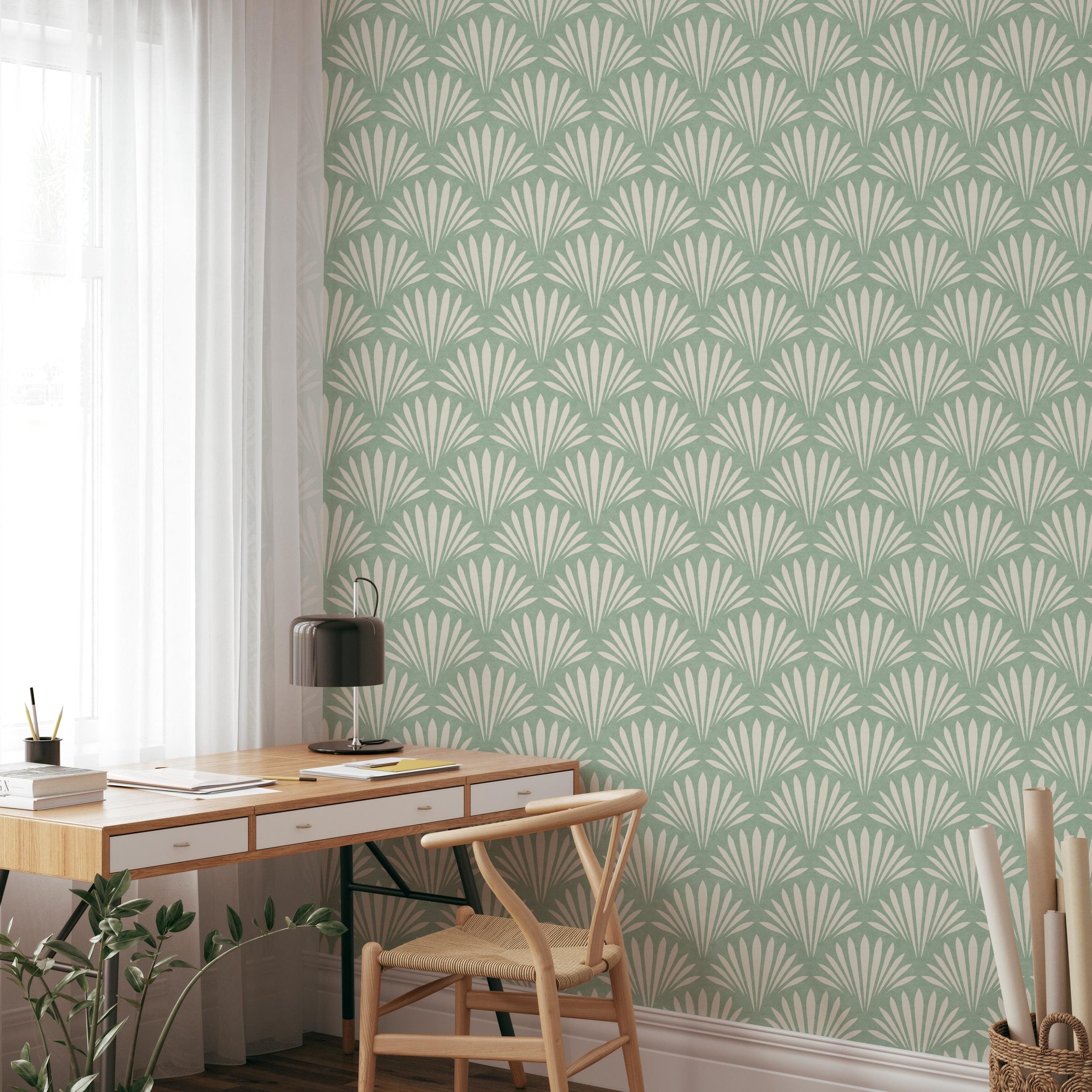 Wallpaper shown in peel and stick or removable pre-pasted in aqua green and off white with seashell palm fan print. A tropical boho modern coastal print for bathroom wallpaper, powder room, baby nursery, bedroom or accent wall.