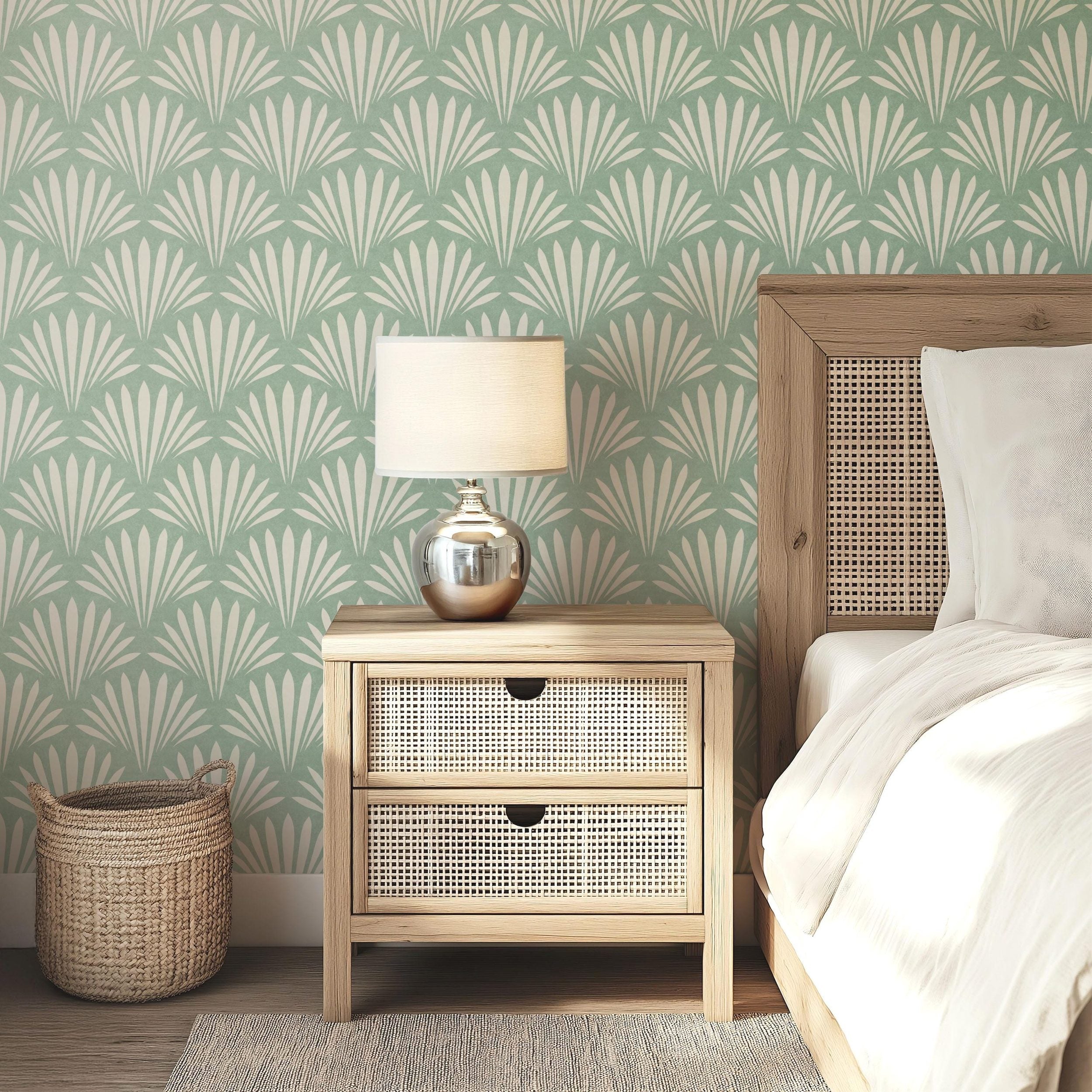 Wallpaper shown in peel and stick or removable pre-pasted in aqua green and off white with seashell palm fan print. A tropical boho modern coastal print for bathroom wallpaper, powder room, baby nursery, bedroom or accent wall.