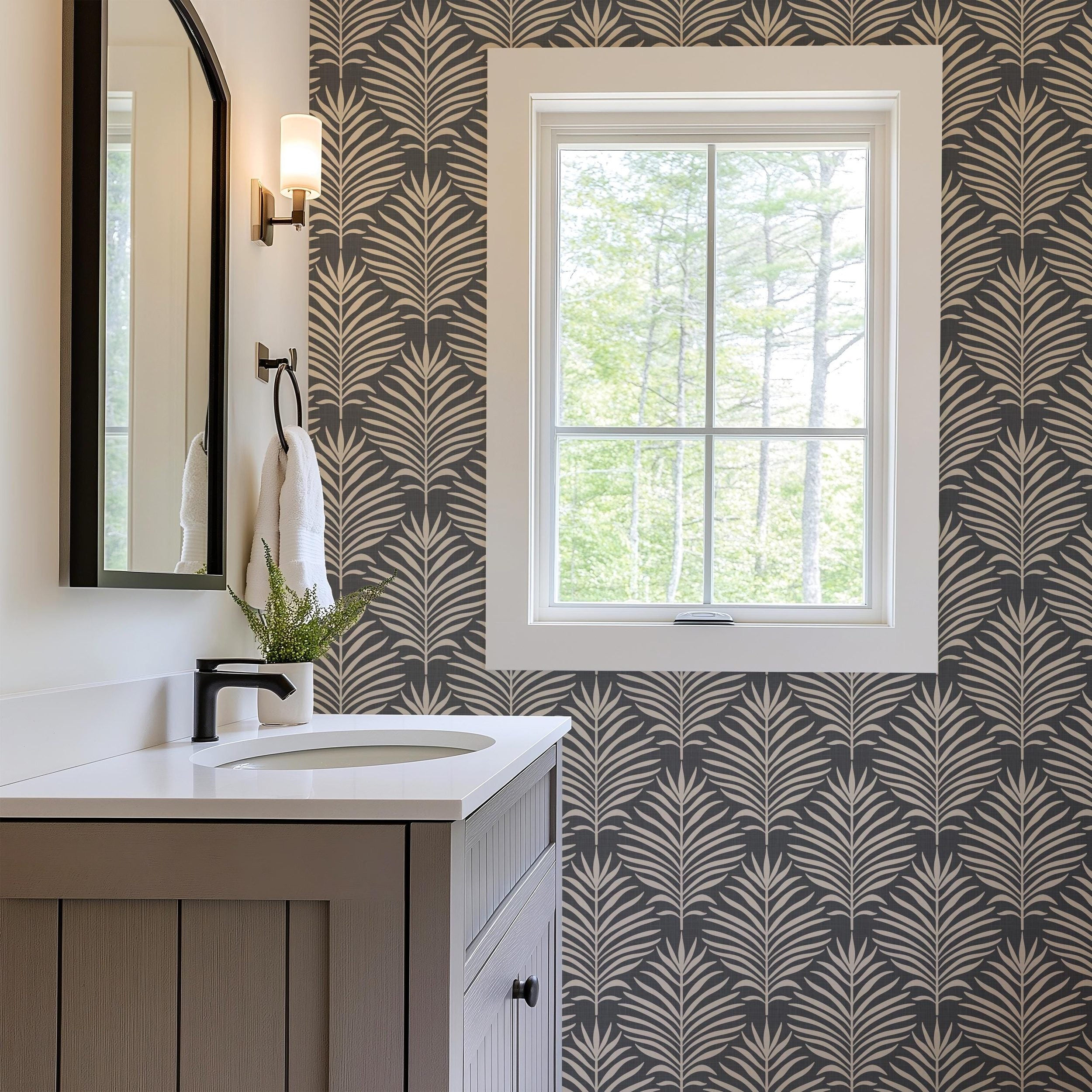 Boho tropical wallpaper shown in peel and stick and prepasted options. Neutral black dark moody botanical palm leaf design for bathroom, powder room, office, living room, dining room, laundry room, and entryway. Renter friendly and removable coastal minimalist look.